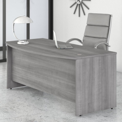 A sleek modern office desk with a gray wood top