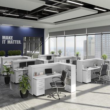 Office space with white desks and blue painted walls