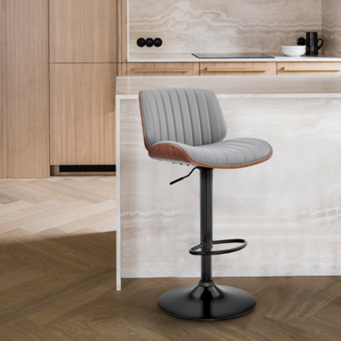Modern gray adjustable bar stool in a stylish kitchen with wooden cabinets and marble counter