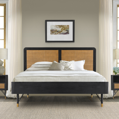 A bedroom with a bed and two nightstands