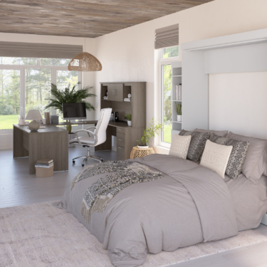 a bedroom with a desk and a bed