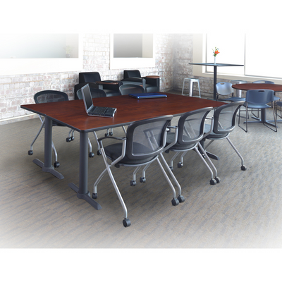 a conference room with a laptop and chairs