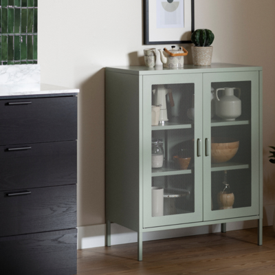 a cabinet with glass doors and a picture on the wall