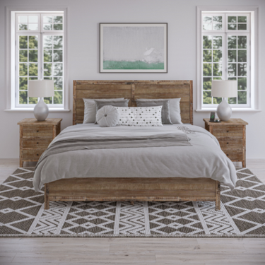 a bed with two nightstands and a painting above it