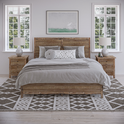 a bed with two nightstands and a painting above it