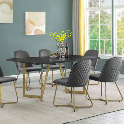 a dining table with chairs in a room with windows