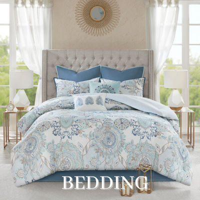 a bed with a headboard and pillows