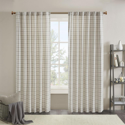 a window with curtains and a basket