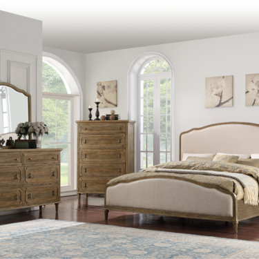 a bedroom with a bed and dresser