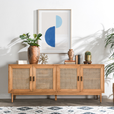 a cabinet with a painting on the wall