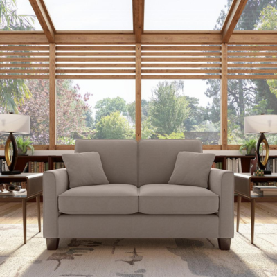 a couch and table in a room with a glass wall