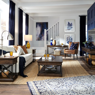 a living room with a blue wall and white walls