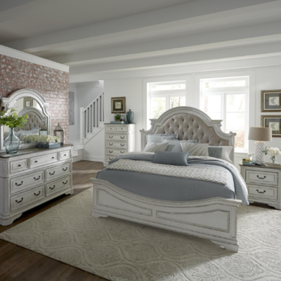 a bedroom with a bed and dresser